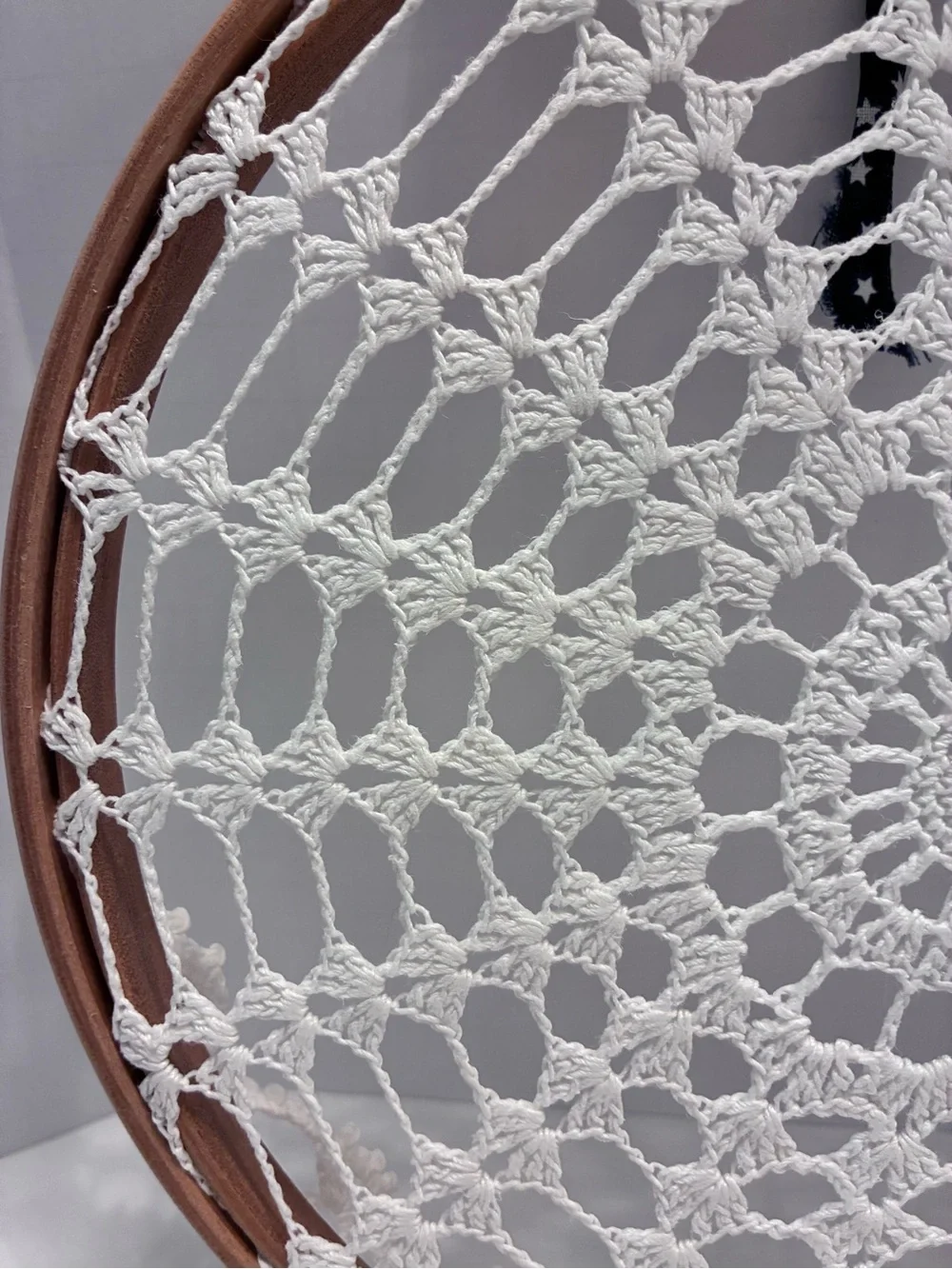 Handmade 10” crochet doily stretched inside a wooden embroidery hoop